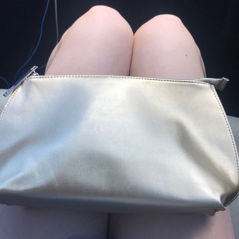 Gold Lancôme makeup bag